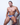 Male model sitting on stool wearing colorful graphic thong with blue waistband from the Malebasics Men Thongs collection.