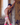 Male model leaning against wall wearing bright pink thong from the Thongs for Men Underwear collection.