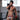 Male model in athletic setting wearing white mesh jockstrap with red waistband from the Malebasics Men Jockstraps collection.