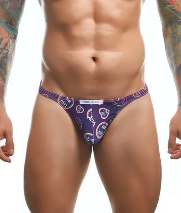 Man wearing a patterned purple men's underwear on a white background
